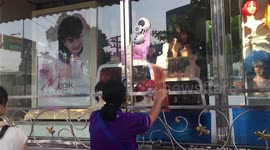 Windows cleaned by weird robot washing machine at Thai beauty shop