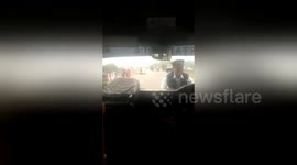 Driver drags traffic policeman on car bonnet after being caught illegally parking