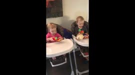 Twins singing the alphabet in unison