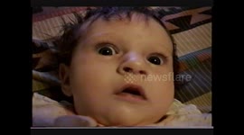 Baby is freaked out by the big camera coming towards her