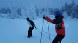 men cross-country skiing in dusk, winter sport