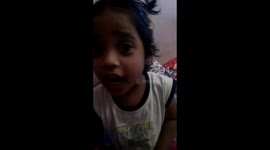 Little girl singing national anthem