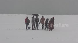Toronto residents can't wait for spring and headed to the beach during the latest snow event in the city