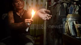 Filipino man coats arm in hot wax in bizarre ritual