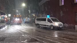 NYC: Snow Plow Drives Through Falling Snow