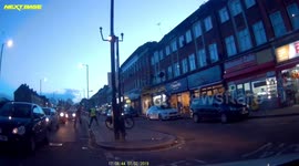 London road rage - cyclist and driver get into fist fight.