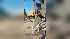 Smooth operator! Digger driver shows off his precision machinery control