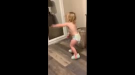 Little girl got the moves dancing in front of the mirror