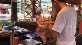 Crikey! Grilled crocodile on display in Thai shopping mall