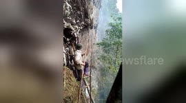 Newsflare Edit - Honey hunters risks their lives working on foothills in Vietnam