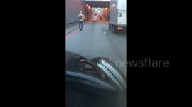 Bloke riding one wheel hoverboard through busy London underpass