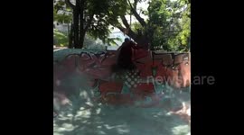 Young Buddhist monk shows off skateboarding skills