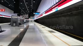The underground train stops at the station, makes a brief stay