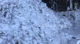 Freezing weather turns Portland waterfall into enchanting icy grotto