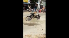 Burning bike in middle of Indian road causes panic and halts traffic