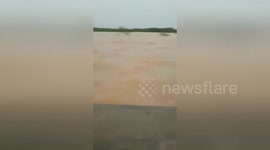 Indonesian floods sees one side of major East Java highway completely submerged