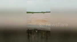 Newsflare Edit - Indonesian floods sees one side of major East Java highway completely submerged