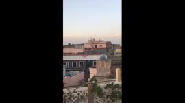 Rooftop sunset with view of the Taj Mahal