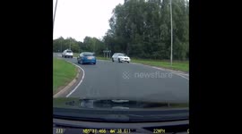 BMW drives wrong way round roundabout