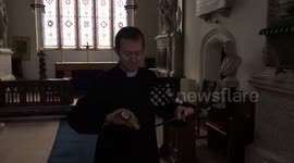 Daredevil vicar stuns worshippers by fire eating in church