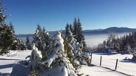 Lovely winter day in mountains high above the poluted city