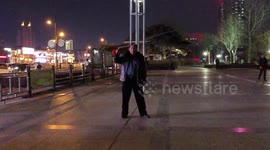 Security guard whips around heavy steel chain to workout