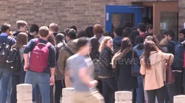Crowd of university of Toronto students heads into building to write final exam as semester ends in Spring