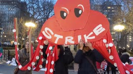 NYC: International Women's Day Demonstrators Hold Puppet That Says 'Strike'