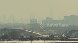 Toronto blanketed by a rare winter smog event this morning creating a scene usually experienced on hot summer days when the humidity and pollution is high.