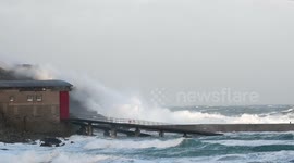 Gale force winds and waves batter the Cornish coast at Sennen