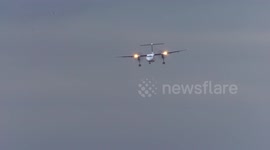 Roller coaster ride! Tiny turboprop plane buffeted by high winds in aborted Dusseldorf landing