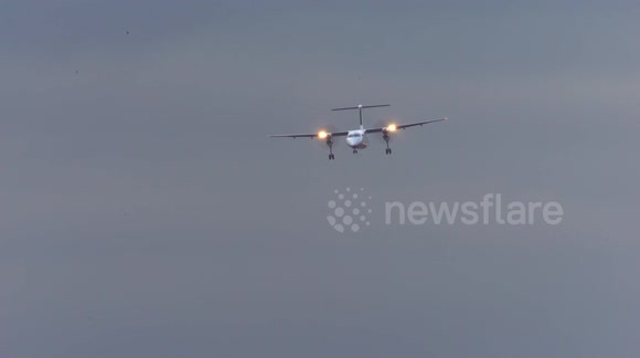 Roller coaster ride! Tiny turboprop plane buffeted by high winds in aborted Dusseldorf landing
