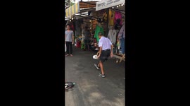 A skilled boy shows his amazing kick-ups with toilet paper