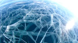 Hypnotic labyrinth of ice tunnels stuns visitors at world's deepest lake