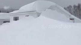 Snow swallows homes whole during Newfoundland winter