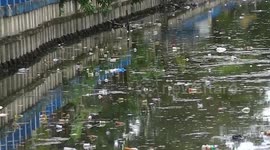 Kids go fishing in pollution-ridden lake in Indonesia