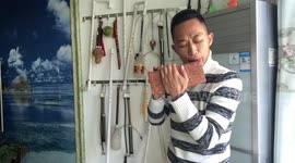 This man in China crafts DIY flutes from bricks, a plastic pipe and a bicycle pump