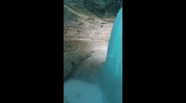 Behind a frozen waterfall
