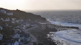 Storm Gareth brings a massive wave crashes into Sennen Cove Cornwall England UK