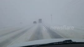 Massive trucks nearly collide during intense Denver blizzard