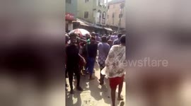 School children being pulled from the building collapse in Lagos
