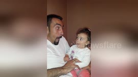 Dad and baby daughter trade funny faces in this utterly adorable clip