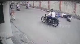 Couple on motorbike survive as telegraph pole falls on them in India