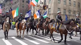 NYC St. Patrick's Day Parade: Mounted police officers carry flags