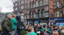 Irish children watching St.Patrick's Day parade