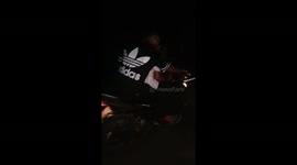 Pair riding on motorcycle keep swapping who's driving in Indonesia