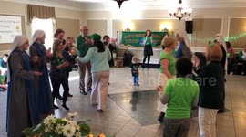 Nuns, child, & others dancing St. Patrick’s Day