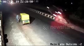 Car goes flying off road divider and bursts into flames in west India