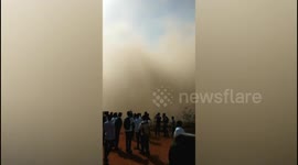 At least two dead and dozens trapped as under-construction building collapses in southwest India