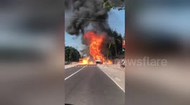 Driver has to reverse to escape burning truck full of exploding butane tanks